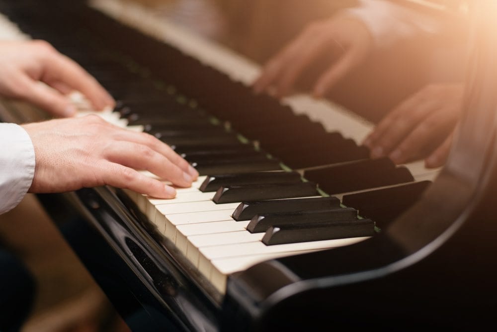 Someone playing a piano