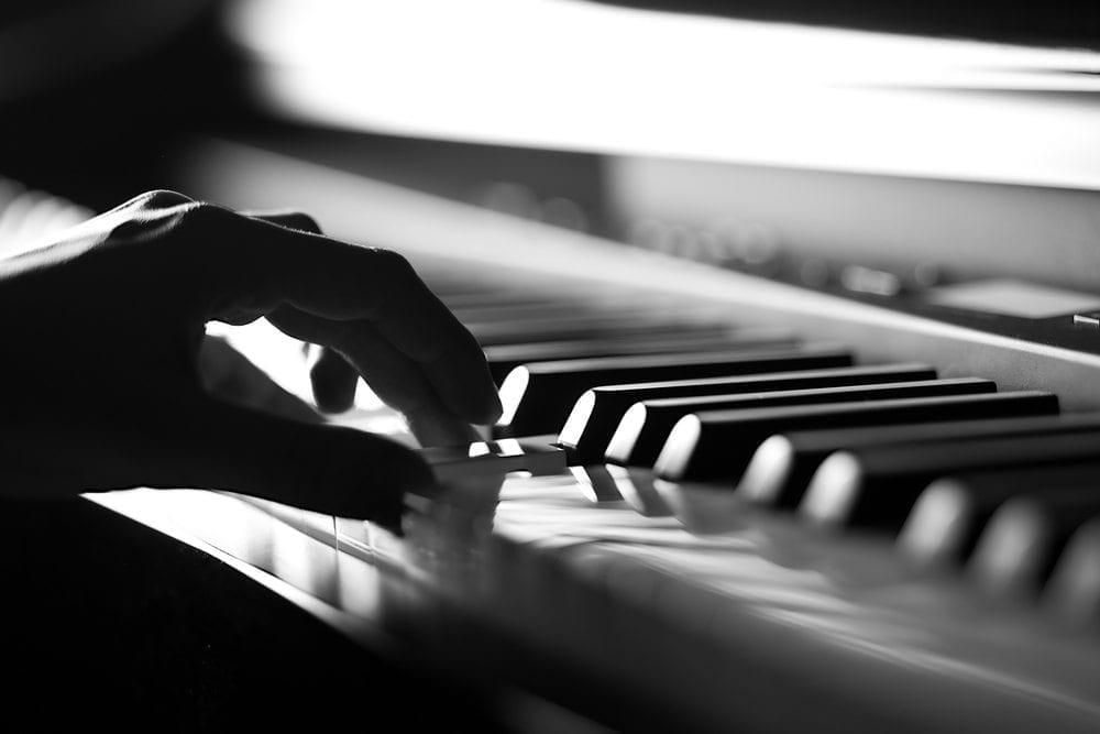 Hand playing piano