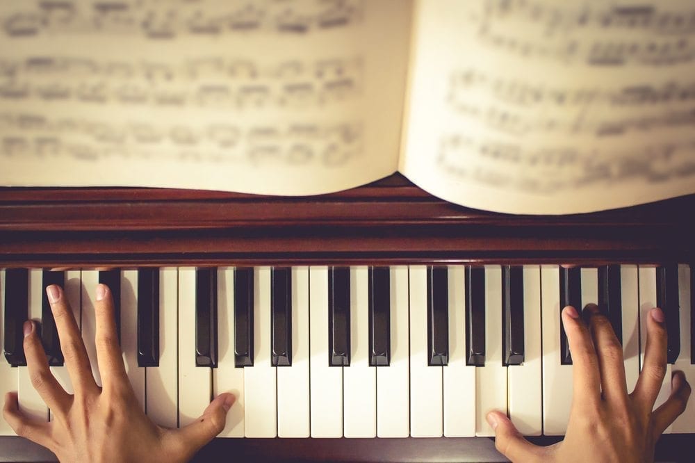 Up close image of person playing the Piano