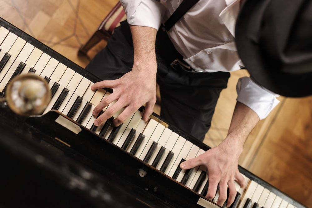 Top view of handsome young men playing piano