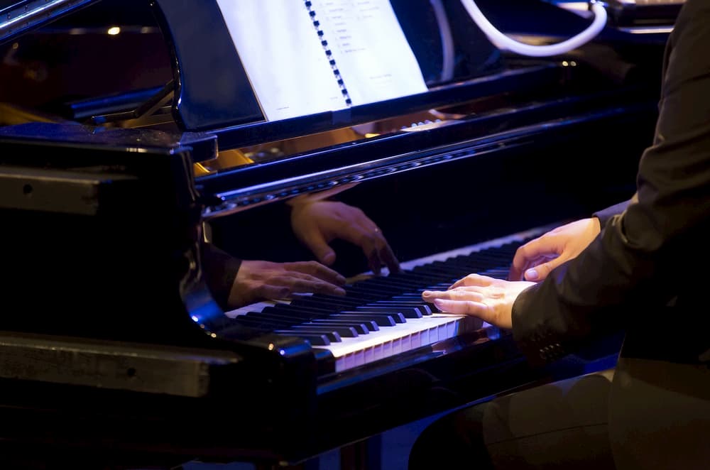 Pianist playing on piano