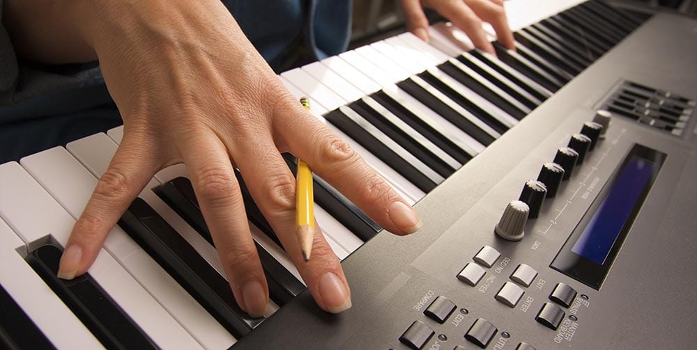 Woman's Fingers on Digital Piano Keys