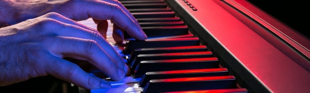 Hands playing an electric keyboard